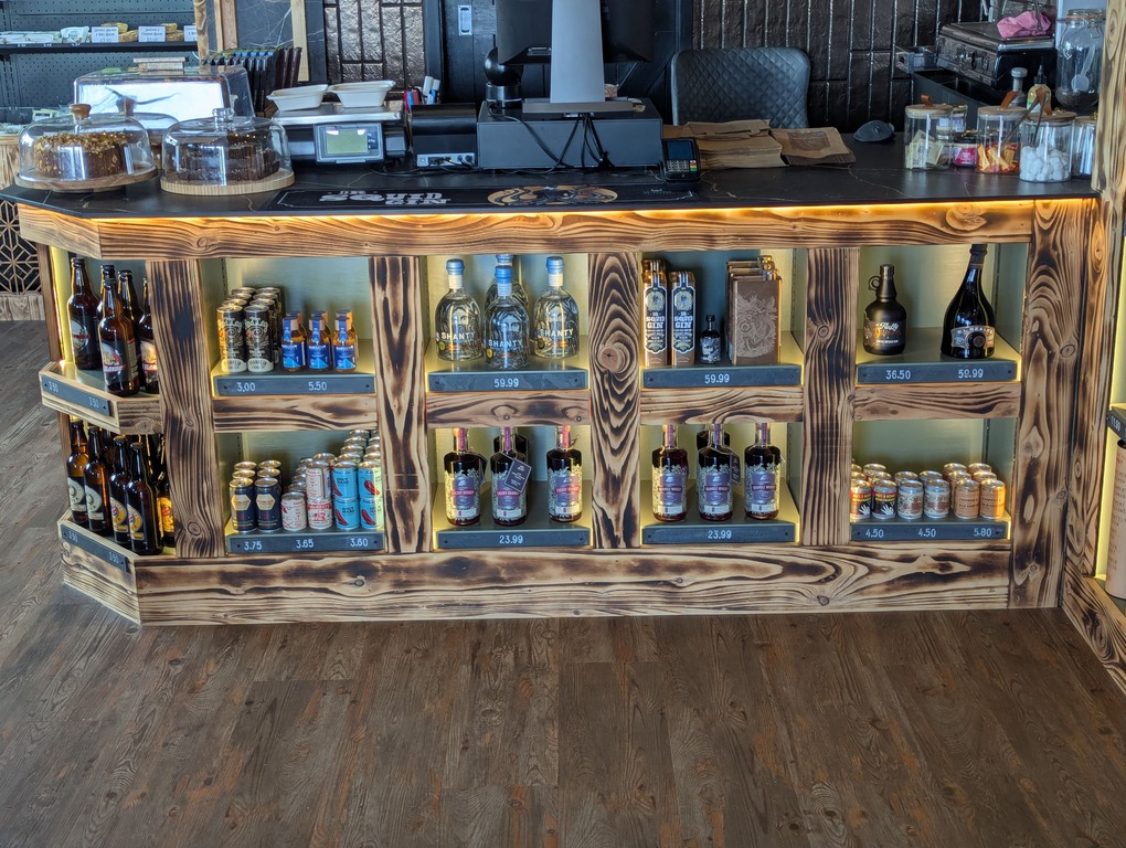 Craft beers and ciders in illuminated wooden display