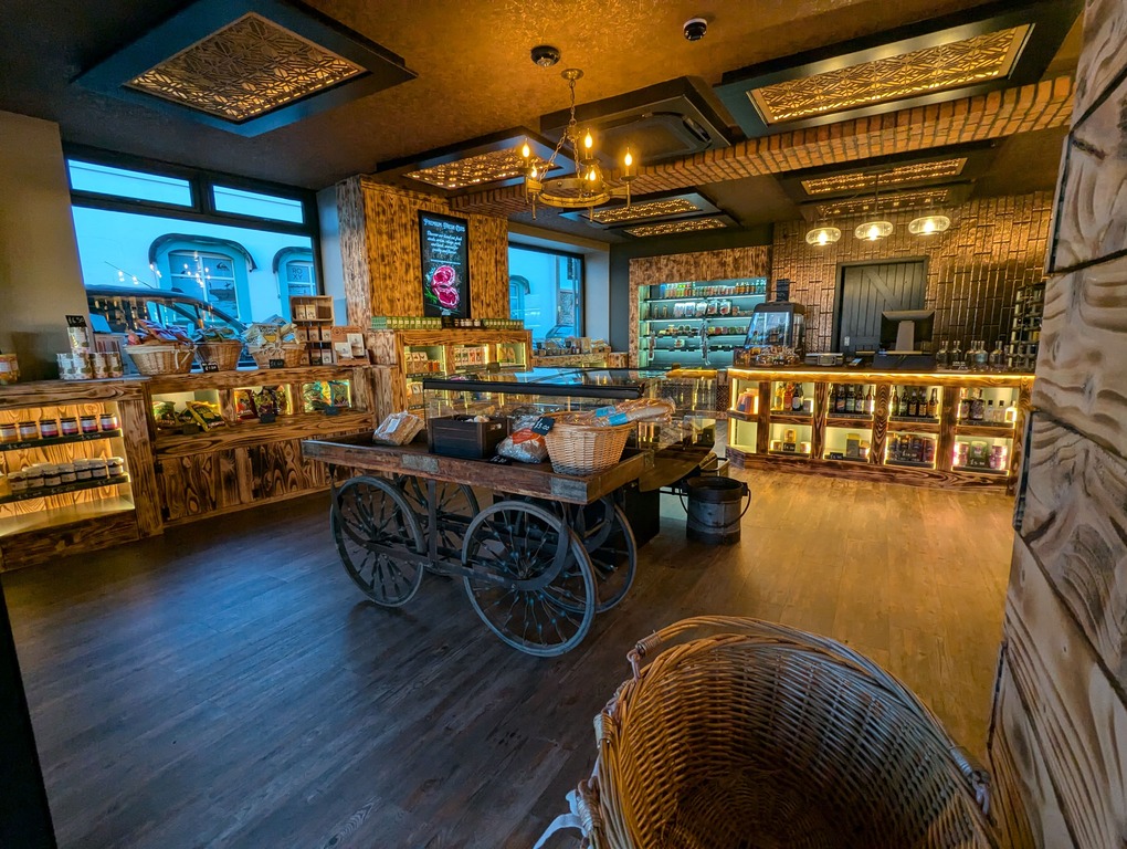 Full shop interior with warm lighting and rustic displays